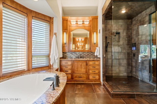 bathroom featuring tiled shower, tile patterned floors, a garden tub, vanity, and backsplash