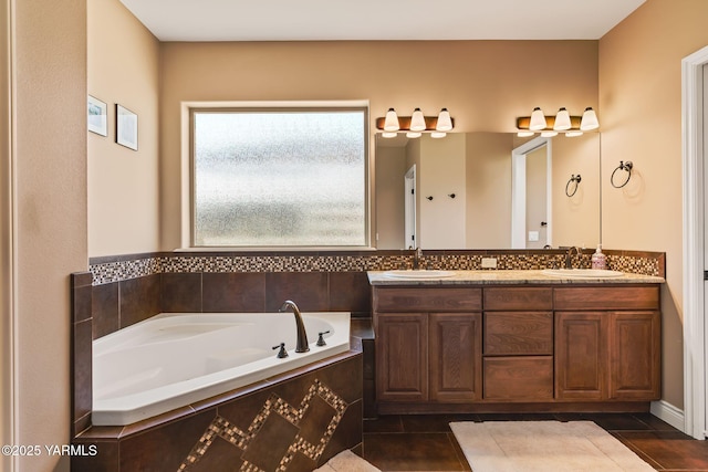 7302 Crown Crest Ave, Yakima, WA 98903 - bathroom with double vanity, a garden tub, and tile patterned flooring