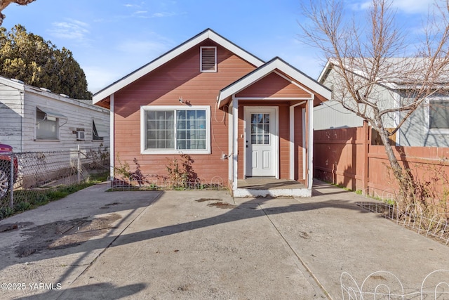 view of front of house featuring fence