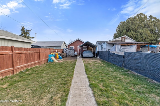 view of yard with a fenced backyard