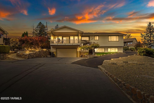 view of front of house featuring concrete driveway and an attached garage