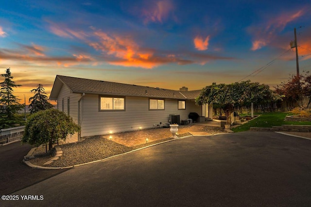 single story home with a patio area and cooling unit