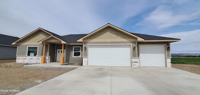 view of front of property with driveway and a garage