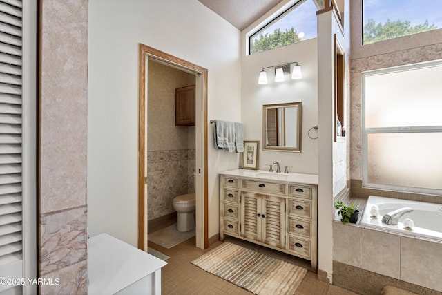 4405 Summitview Ave, Yakima, WA 98908 - full bathroom with vanity, a garden tub, toilet, tile patterned flooring, and lofted ceiling