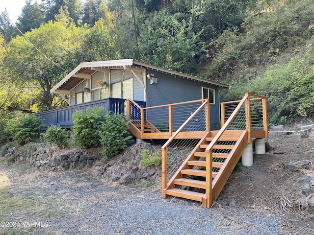 230 Pine Cliffs Dr, Naches, WA 98937 - view of property exterior with a deck, stairway, and a forest view