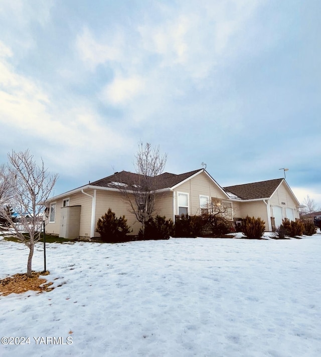 view of snow covered property