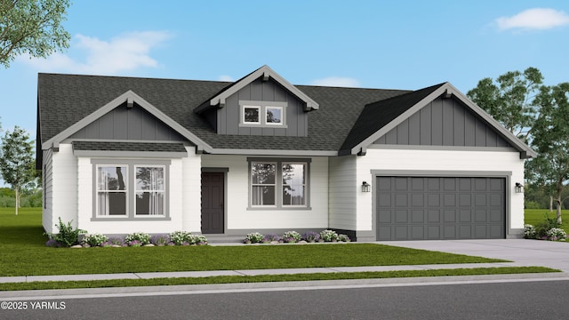 4800 W Larch Ave, Yakima, WA 98903 - view of front of home with board and batten siding, a garage, concrete driveway, and a front lawn