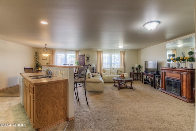 617 Westwind Dr, Zillah, WA 98953 - living room with light carpet and a glass covered fireplace
