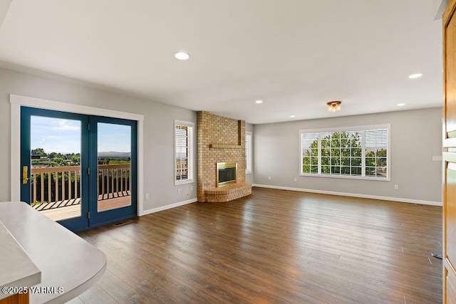 7905 Englewood Ave, Yakima, WA 98908 - unfurnished living room featuring baseboards, wood finished floors, recessed lighting, and a fireplace