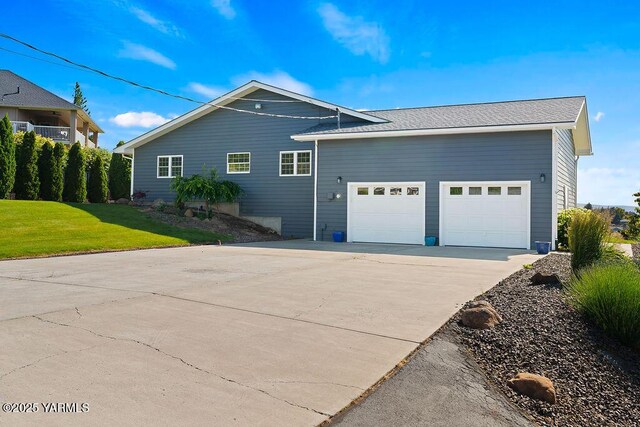 7905 Englewood Ave, Yakima, WA 98908 - view of home's exterior with an attached garage, concrete driveway, and a yard