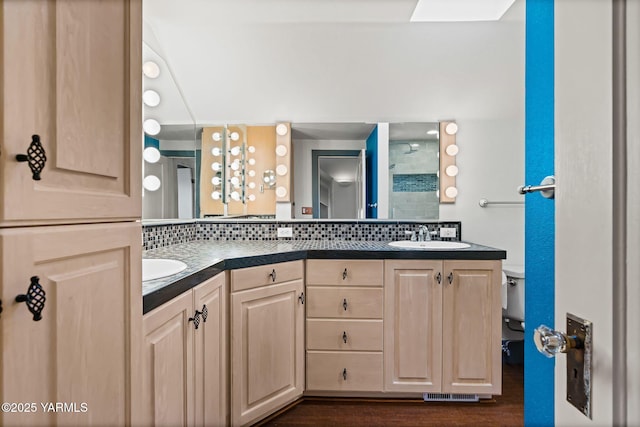 full bath with double vanity, tasteful backsplash, visible vents, a shower stall, and a sink