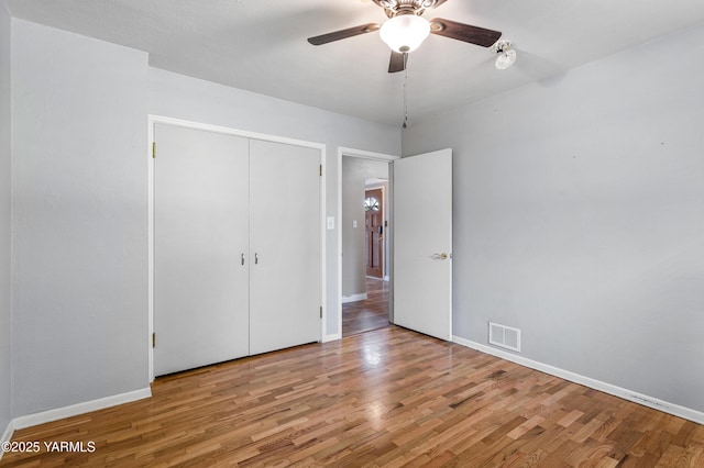 118 Glen Dr, Zillah, WA 98953 - unfurnished bedroom with wood finished floors, a closet, and ceiling fan
