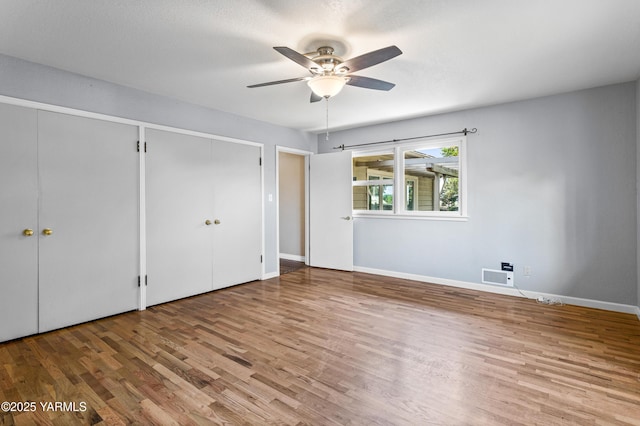 118 Glen Dr, Zillah, WA 98953 - unfurnished bedroom with wood finished floors and a ceiling fan