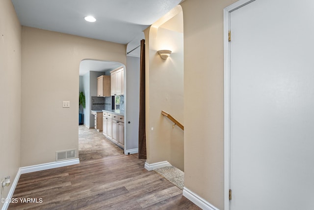 118 Glen Dr, Zillah, WA 98953 - hallway with light wood-type flooring, arched walkways, and recessed lighting