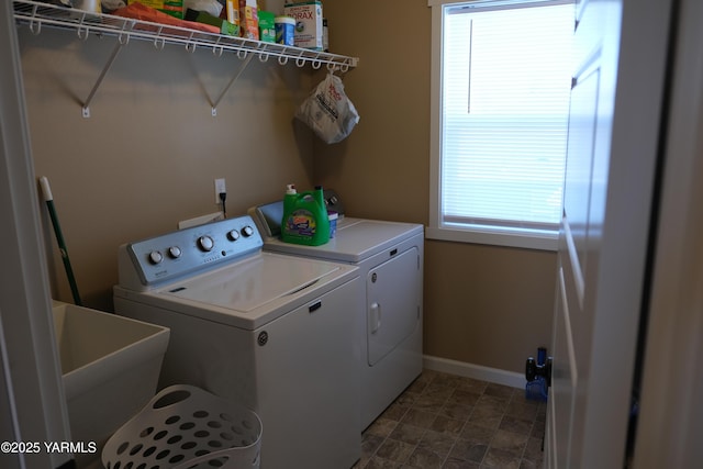 2206 Porter Loop, Yakima, WA 98901 - washroom featuring washer and dryer, baseboards, and stone finish floors