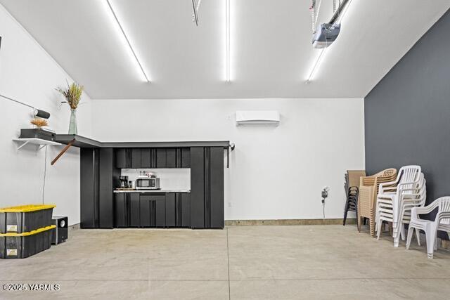 1319 S 15th Ave, Yakima, WA 98902 - garage featuring a wall mounted AC and a garage door opener