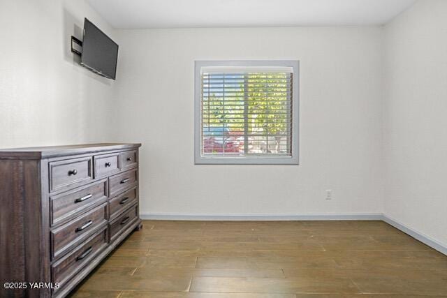 1319 S 15th Ave, Yakima, WA 98902 - unfurnished bedroom with wood finished floors and baseboards