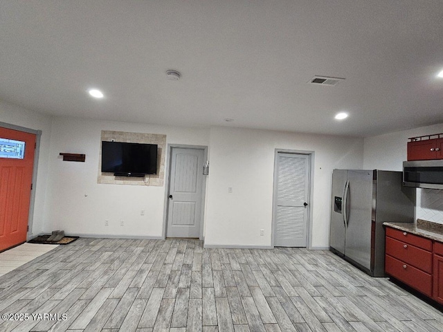 interior space featuring visible vents, recessed lighting, baseboards, and light wood-style floors