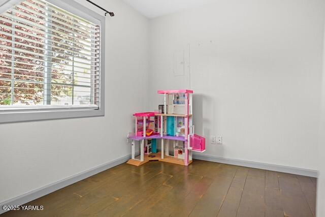 1319 S 15th Ave, Yakima, WA 98902 - game room with wood-type flooring and baseboards