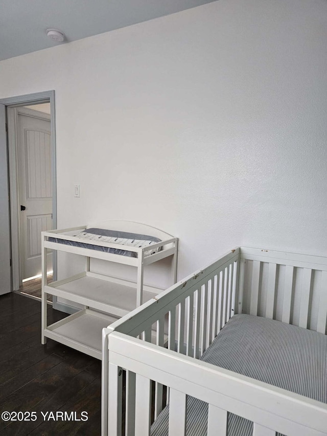 bedroom with wood finished floors