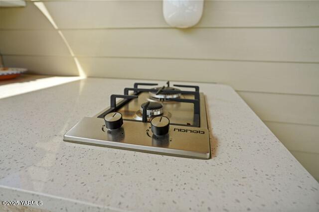 1319 S 15th Ave, Yakima, WA 98902 - kitchen view of stainless steel gas stovetop and light countertops