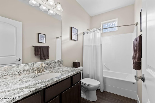 full bathroom featuring toilet, shower / bath combo with shower curtain, wood finished floors, and vanity