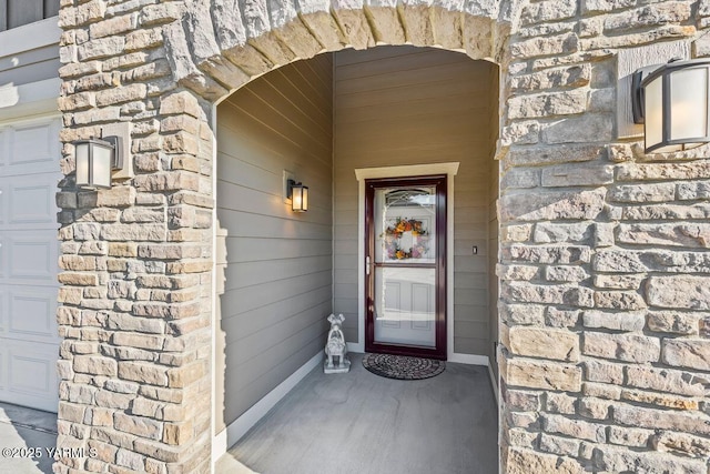 doorway to property featuring an attached garage