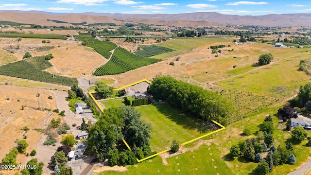 1531 Old Stage Way, Yakima, WA 98908 - aerial view of sparsely populated area with property parcel outlined, a mountainous background, and rows of crops