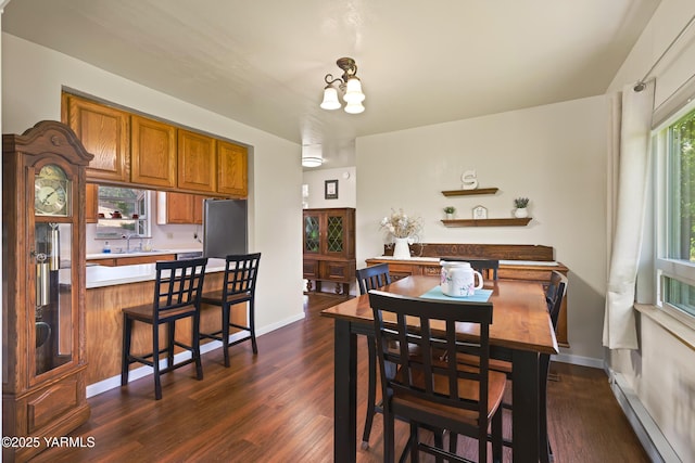1531 Old Stage Way, Yakima, WA 98908 - dining space featuring dark wood finished floors, baseboard heating, and a chandelier