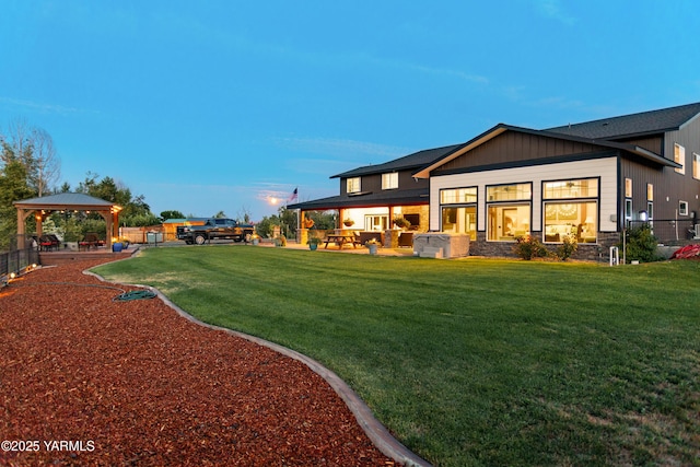 1355 Cook Rd, Yakima, WA 98908 - yard at dusk featuring a gazebo and a lawn