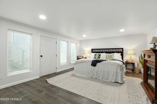 2810 Butterfield Rd, Yakima, WA 98901 - bedroom with dark wood-type flooring, a glass covered fireplace, recessed lighting, and crown molding