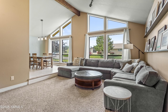 5504 Webster Ave, Yakima, WA 98908 - carpeted living area with beam ceiling and high vaulted ceiling