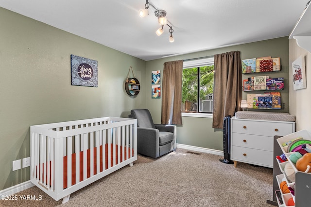 5504 Webster Ave, Yakima, WA 98908 - bedroom with carpet flooring and a nursery area