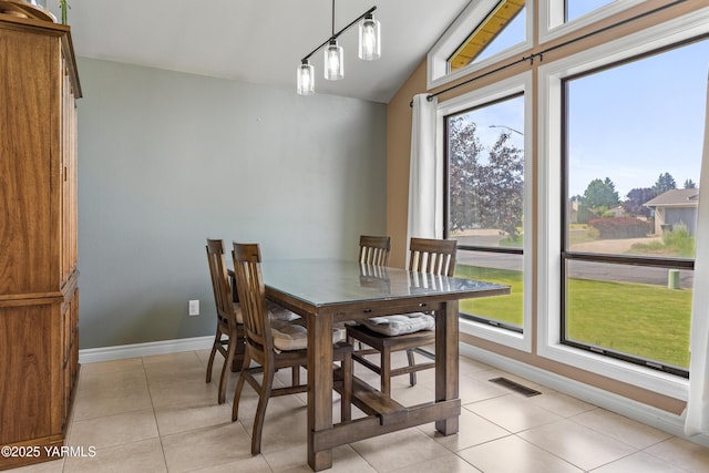 5504 Webster Ave, Yakima, WA 98908 - dining space featuring healthy amount of natural light, light tile patterned flooring, and lofted ceiling