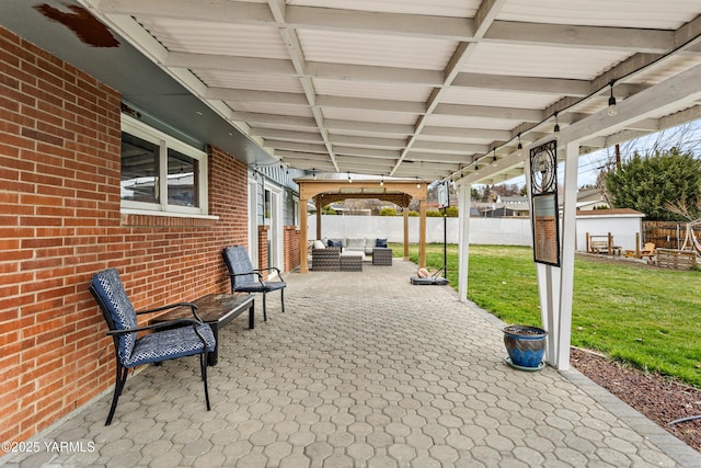 view of patio with an outdoor hangout area and a fenced backyard