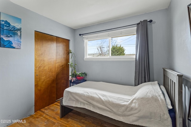 bedroom featuring wood finished floors