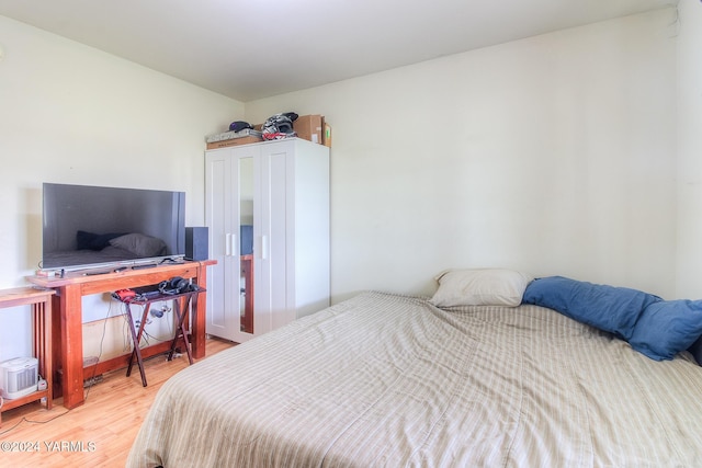 bedroom with wood finished floors