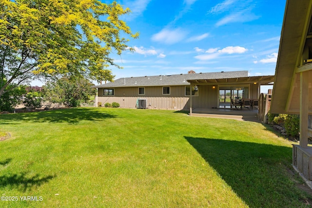 10800 Zier Rd, Yakima, WA 98908 - rear view of house featuring a yard, a patio area, cooling unit, and board and batten siding