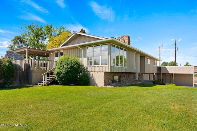 10800 Zier Rd, Yakima, WA 98908 - rear view of property with a chimney, a lawn, a wooden deck, and stairway