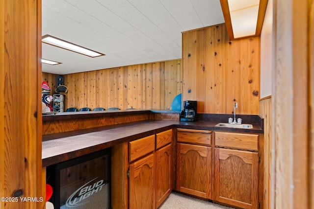 10800 Zier Rd, Yakima, WA 98908 - bar featuring a sink, wood walls, and light colored carpet