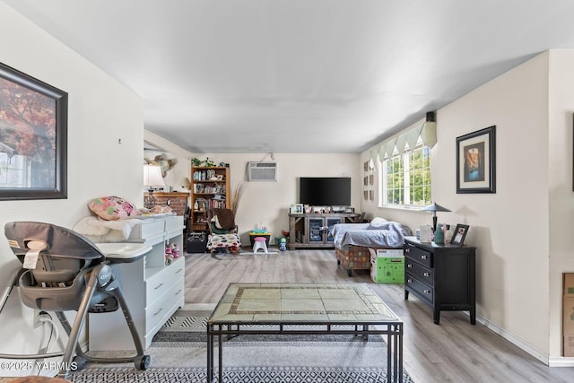 101 N 56th Ave, Yakima, WA 98908 - living area featuring wood finished floors and a wall mounted air conditioner