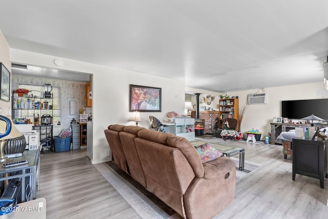 101 N 56th Ave, Yakima, WA 98908 - living area featuring light wood-type flooring and a wall unit AC