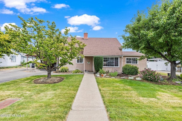 101 N 56th Ave, Yakima, WA 98908 - view of front facade with a chimney and roof with shingles
