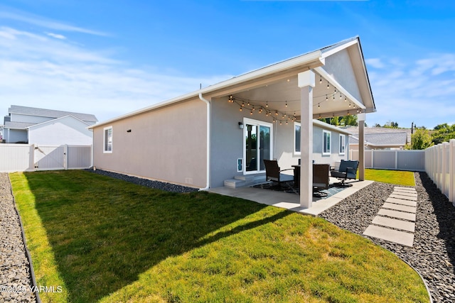7402 Viewcrest Way, Yakima, WA 98908 - back of property featuring a fenced backyard, a patio, a gate, and stucco siding