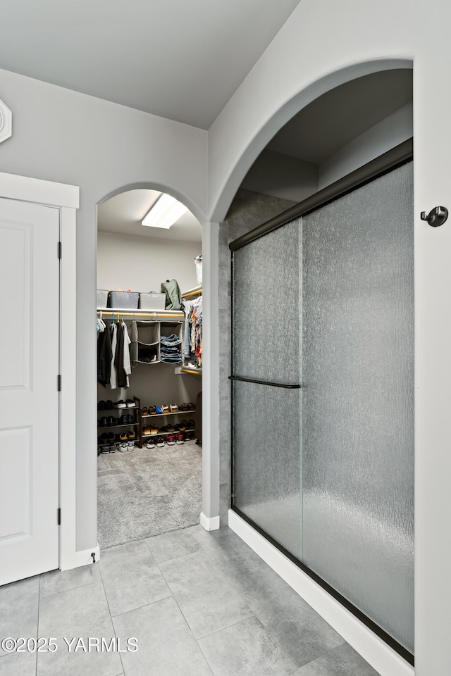 7402 Viewcrest Way, Yakima, WA 98908 - bathroom featuring a spacious closet, a shower stall, and tile patterned flooring