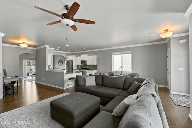 7402 Viewcrest Way, Yakima, WA 98908 - living area featuring dark wood finished floors, a ceiling fan, healthy amount of natural light, recessed lighting, and arched walkways