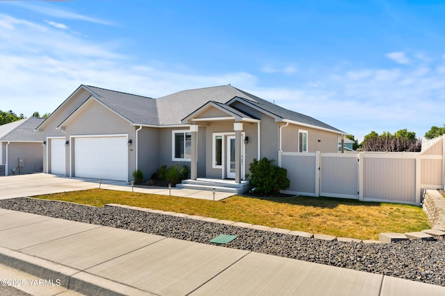 7402 Viewcrest Way, Yakima, WA 98908 - ranch-style house featuring an attached garage, concrete driveway, stucco siding, and a gate
