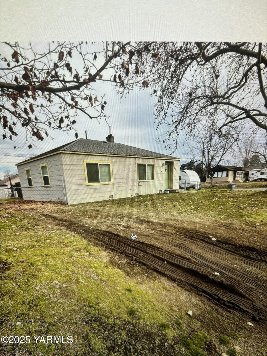 rear view of house with a lawn