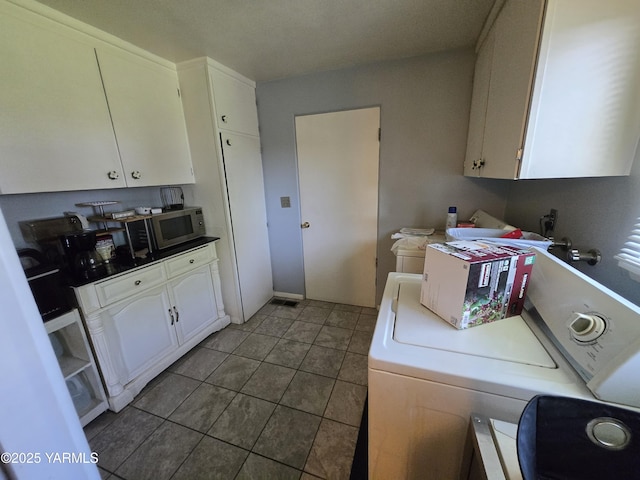 3204 W Viola Ave, Yakima, WA 98902 - laundry room with washer / dryer and tile patterned flooring
