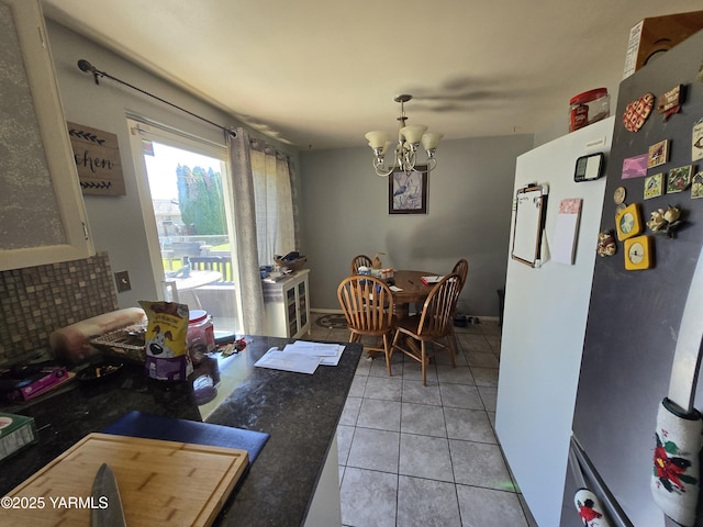 3204 W Viola Ave, Yakima, WA 98902 - dining space featuring a chandelier and light tile patterned floors